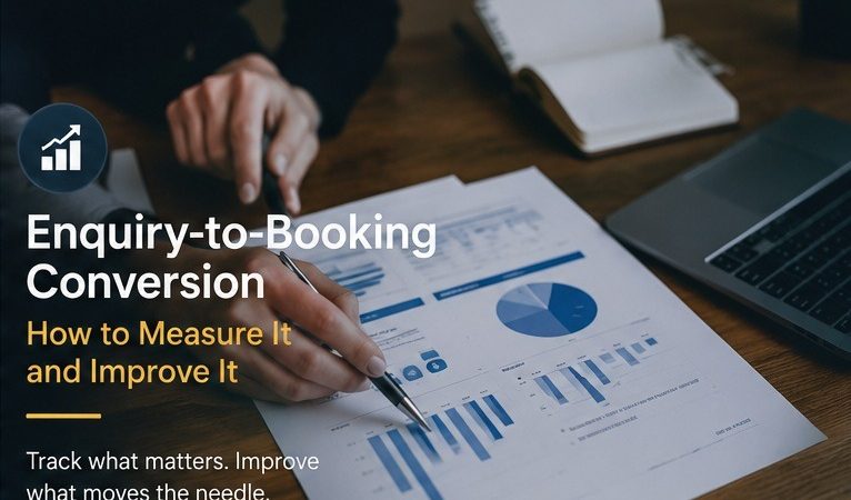 Person pointing at printed charts with a pen to review enquiry-to-booking conversion figures